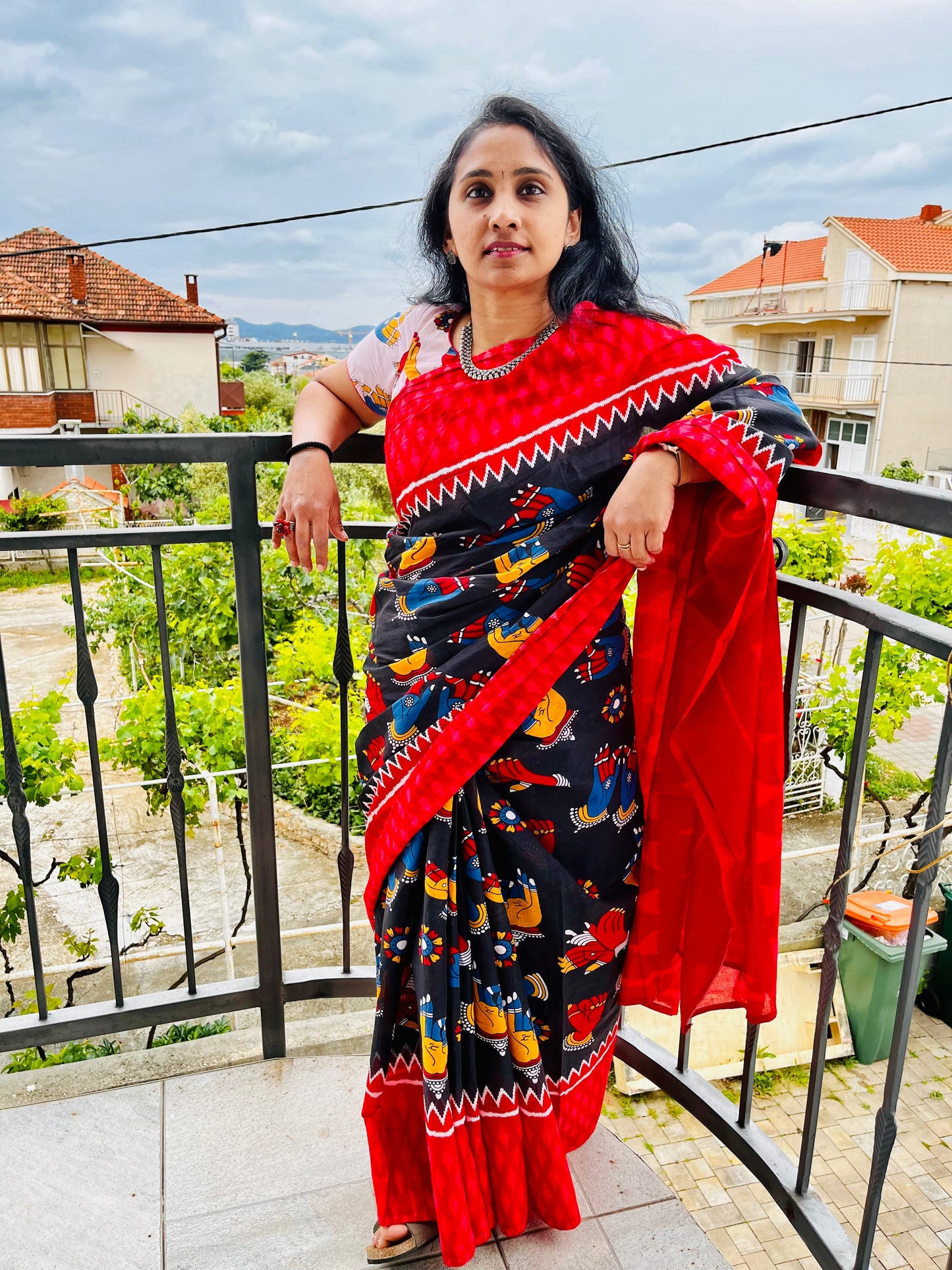 Pretty black body with Mudras printed pure cotton saree