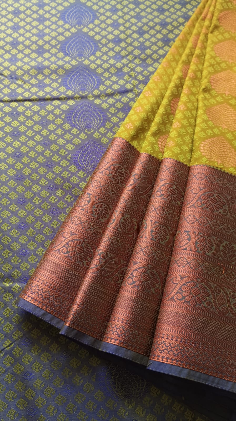 Leaf green skirt with double shade copper zari buttas in the border. Paavadai sattai for children & teenagers