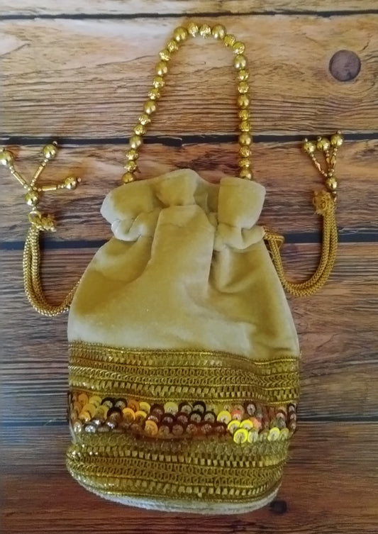 Beige Potli with golden sequins and beads work