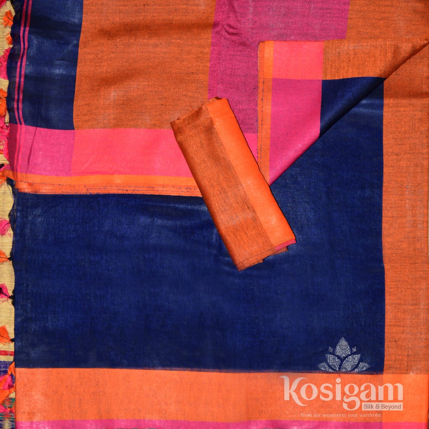 Blue linen saree with orange pallu and border