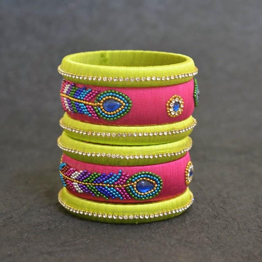 Radiant green with pink silk thread bangles - Peacock feather design