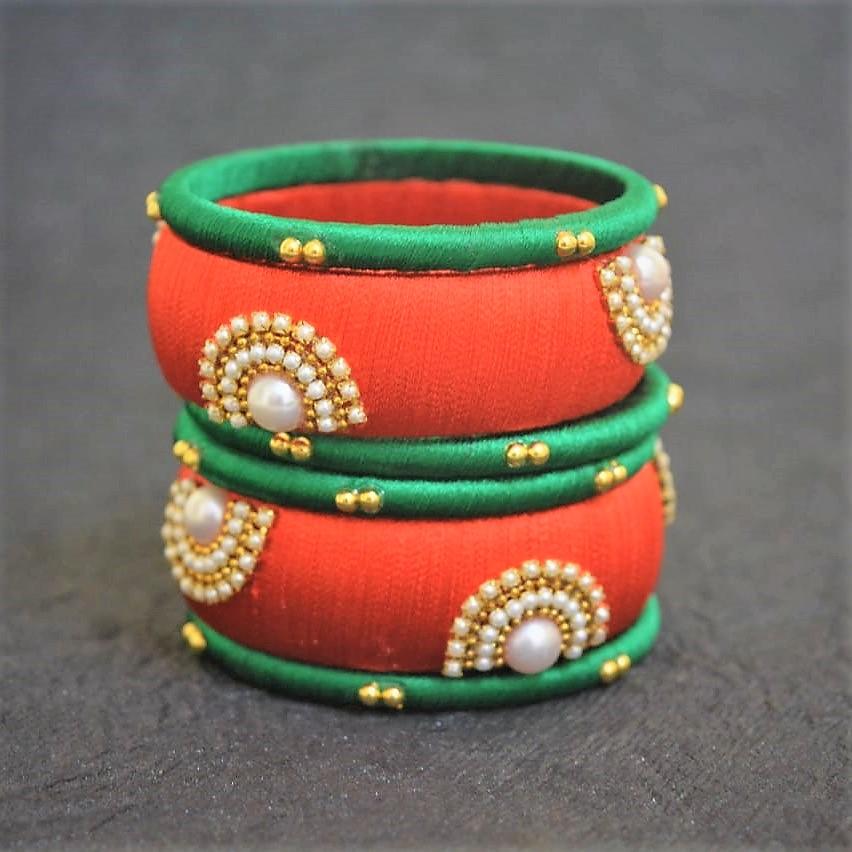 Fanta Orange with green silk thread bangles.